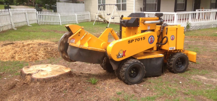 Tree stump removal with a grinder in Millbrook, Alabama
